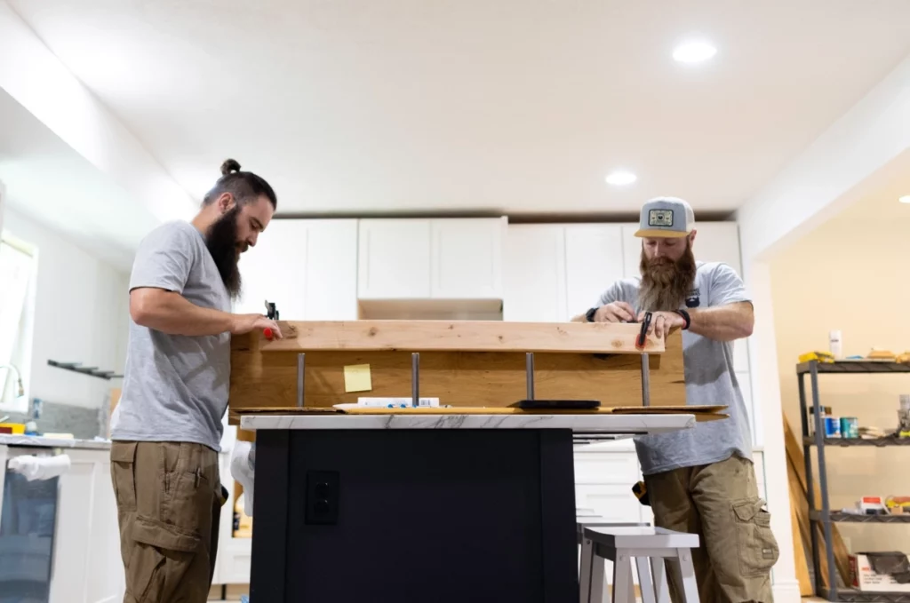 Two men working at counter top